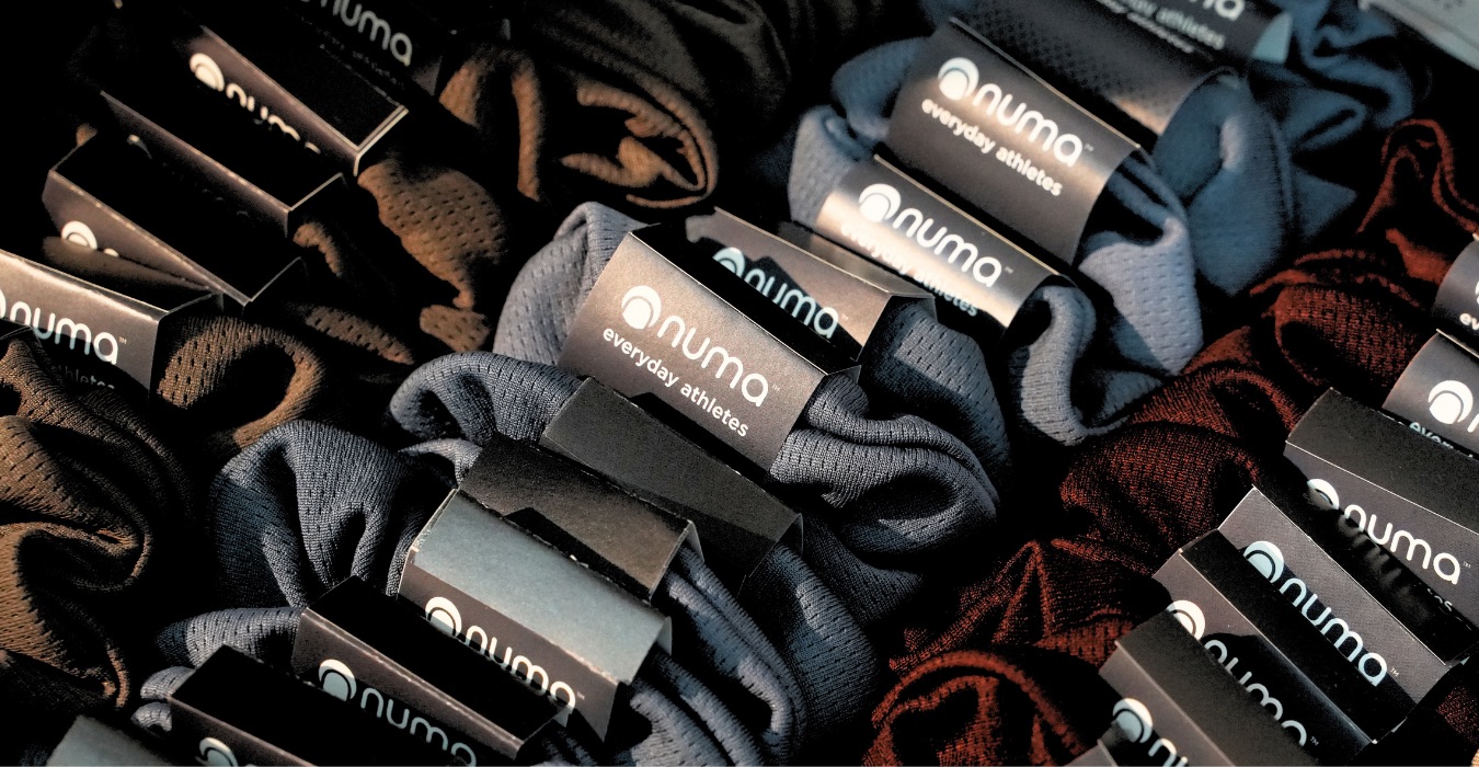 NUMA activewear na may branded packaging at labels mula sa merchant story